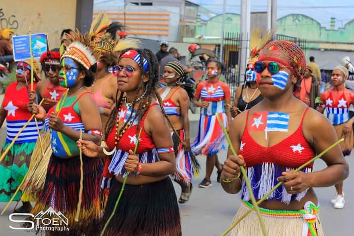 A celebration of Melanesian West Papuan identity, with a group of women in West Papuan dress.