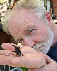 Dr George McGavin and a giant beetle. Lost Land of the Volcano, BBC