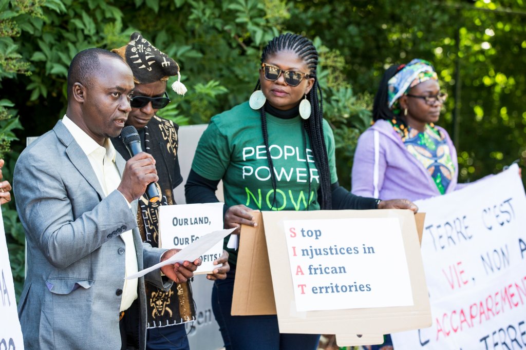 Rita Uwaka and Friends of the Earth protest about palm oil company and RSPO member Siat's human rights abuses against local communities.